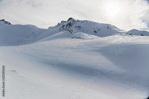 Panoramic view of the snow-covered Alps in winter, in the canton of Graubünden in Switzerland. © serghi8