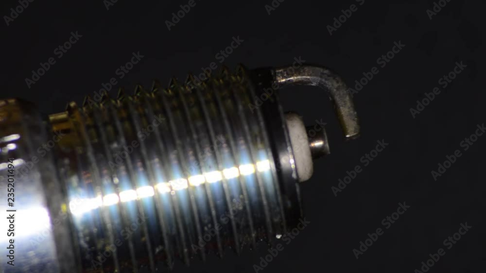 Car candle, principle of operation, blue spark. Macro. Car candle, principle of operation, blue spark. Macro.