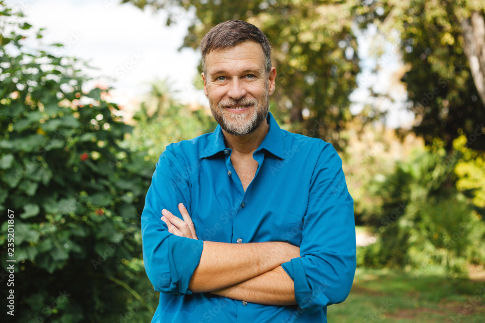Portrait of Senior man caucasian smiling and looking at camera, outside in park. Portrait of Senior man caucasian smiling and looking at camera, outside in park.