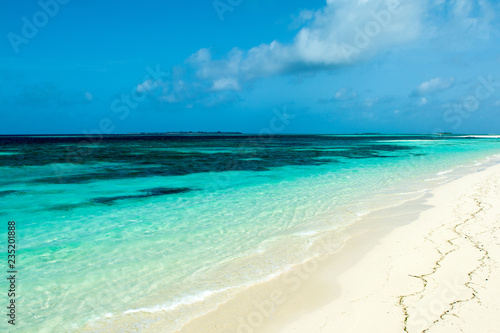 Beautiful landscape of clear turquoise Indian ocean  Maldives islands