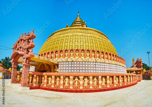 Visit pagoda of Sitagu International Buddhist Academy and enjoy its ornate exterior with fine plasterwork and traditional Burmese decors, Sagaing, Myanmar. photo