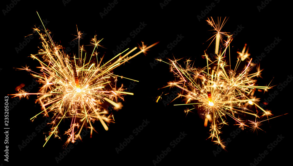 Set of Christmas sparkler burning isolated on black background. Set of Christmas sparkler burning isolated on black background.
