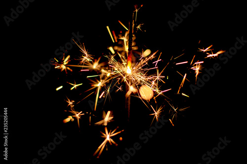 Set of Christmas sparkler burning isolated on black background.