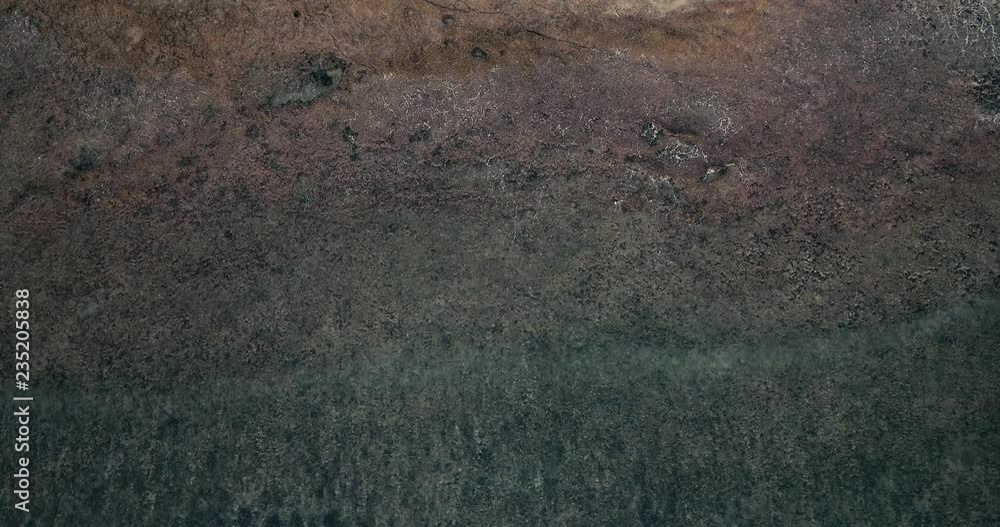 Aerial view beautiful of sea waves from drone. Stock footage of blue color ocean water, wave, sea surface. Top view on turquoise waves, clear water surface texture. Top view, amazing nature background Aerial view beautiful of sea waves from drone. Stock footage of blue color ocean water, wave, sea surface. Top view on turquoise waves, clear water surface texture. Top view, amazing nature background