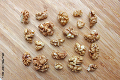 walnut kernels in the shape of a rectangle on a wooden kitchen board