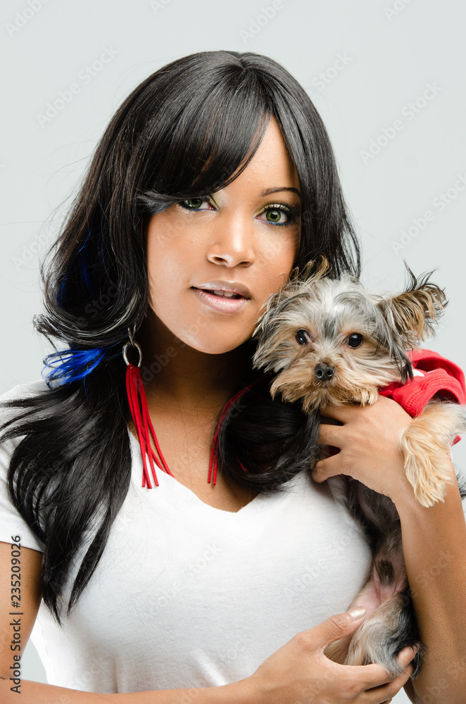 Young African American Woman Holding Small Dog Young African American Woman Holding Small Dog