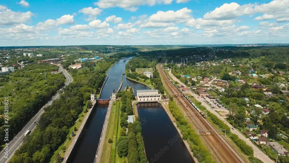 Sluice Gates on the River. Aerial view river sluice construction, water river gateway. Shipping channel on the river. 4K, flying video, aerial footage Sluice Gates on the River. Aerial view river sluice construction, water river gateway. Shipping channel on the river. 4K, flying video, aerial footage