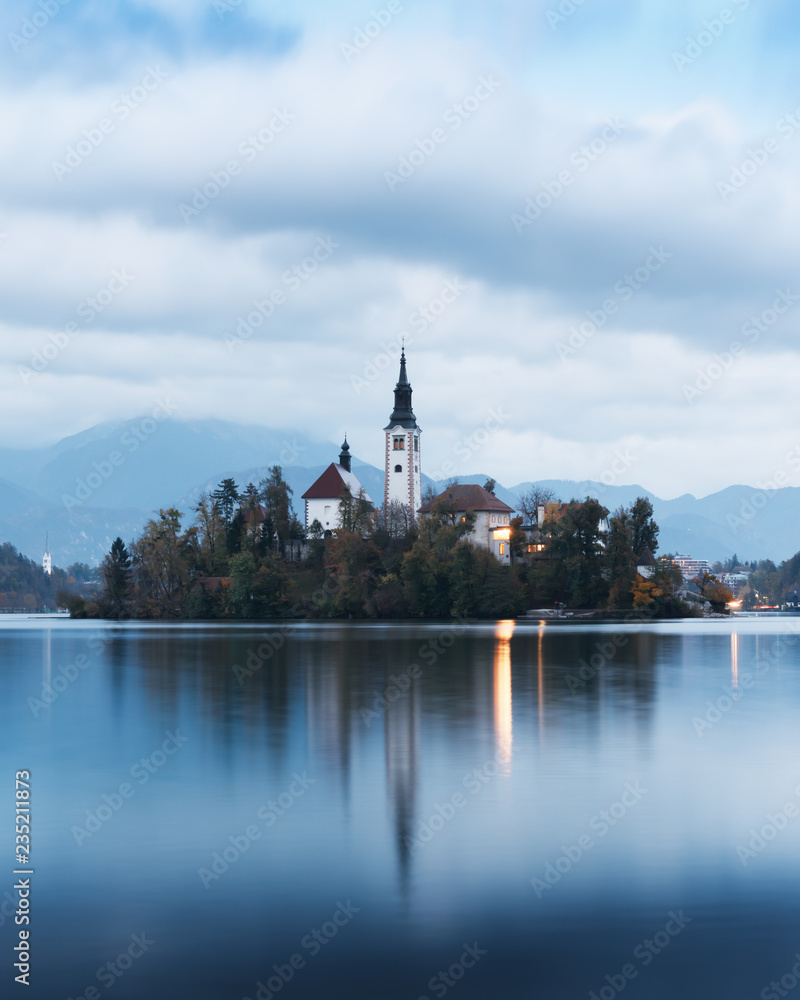Evening autumn view of Bled lake in Julian Alps, Slovenia. Pilgrimage church of the Assumption of Maria on a foreground. Landscape photography