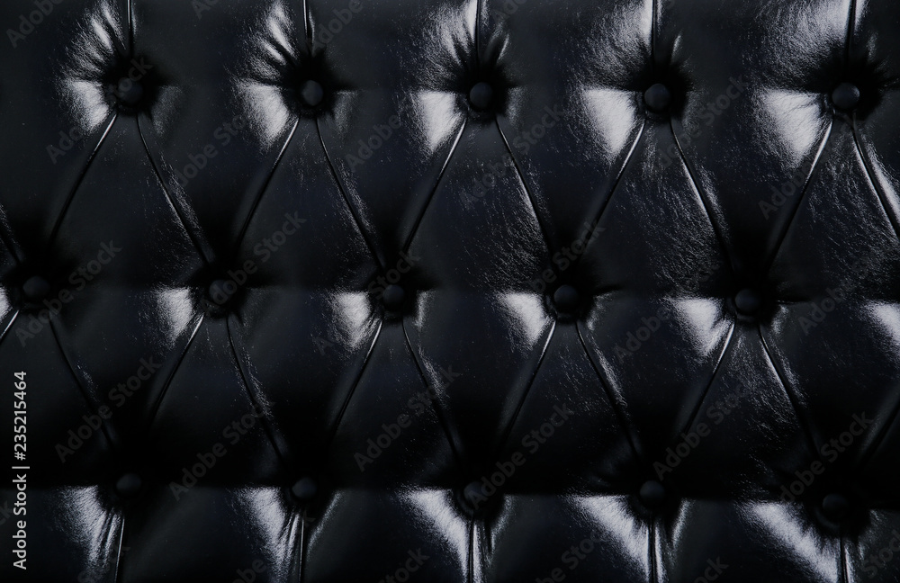 Black background. Black leather sofa back background for design. Stock