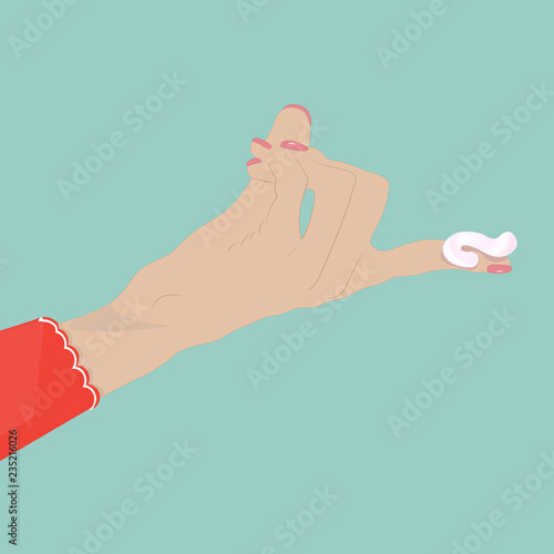 A woman's hand with a cosmetic cream on her fingers