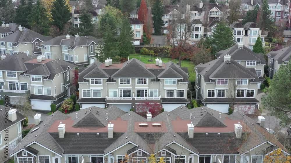 A perfect neighbourhood. Houses in suburb at Summer in the north America. Luxury houses with nice landscape. Aerial drone view. A perfect neighbourhood. Houses in suburb at Summer in the north America. Luxury houses with nice landscape. Aerial drone view.