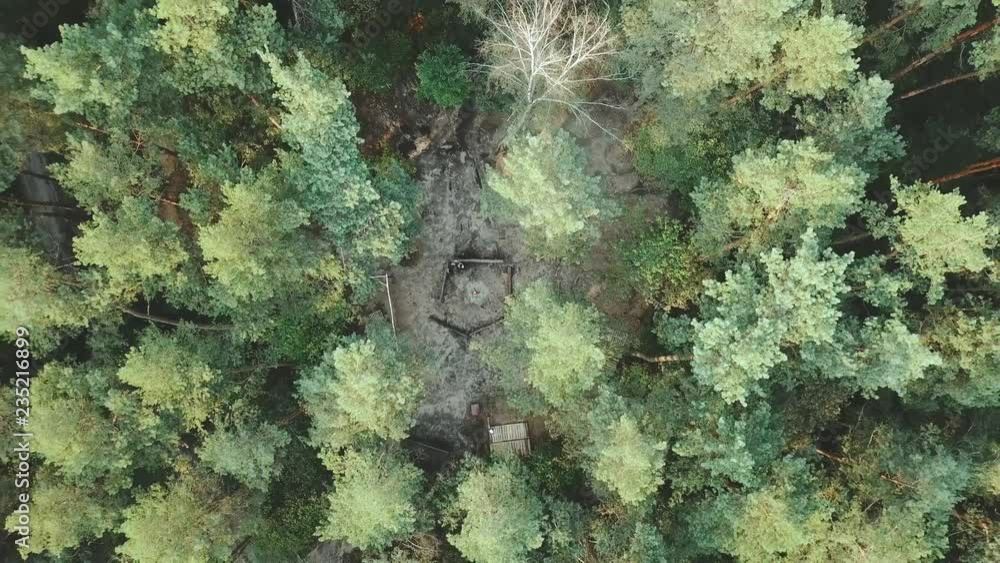 Aerial View. Flying over the beautiful forest trees. Aerial camera shot. Landscape panorama.Aerial view of camping fireplace in summer forest. Aerial View. Flying over the beautiful forest trees. Aerial camera shot. Landscape panorama.Aerial view of camping fireplace in summer forest.