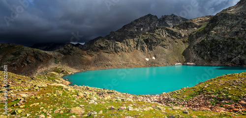 Sophia lake in the mountains of Arkhyz. The beautiful summer panorama landscape with mountain and lake with blue water.