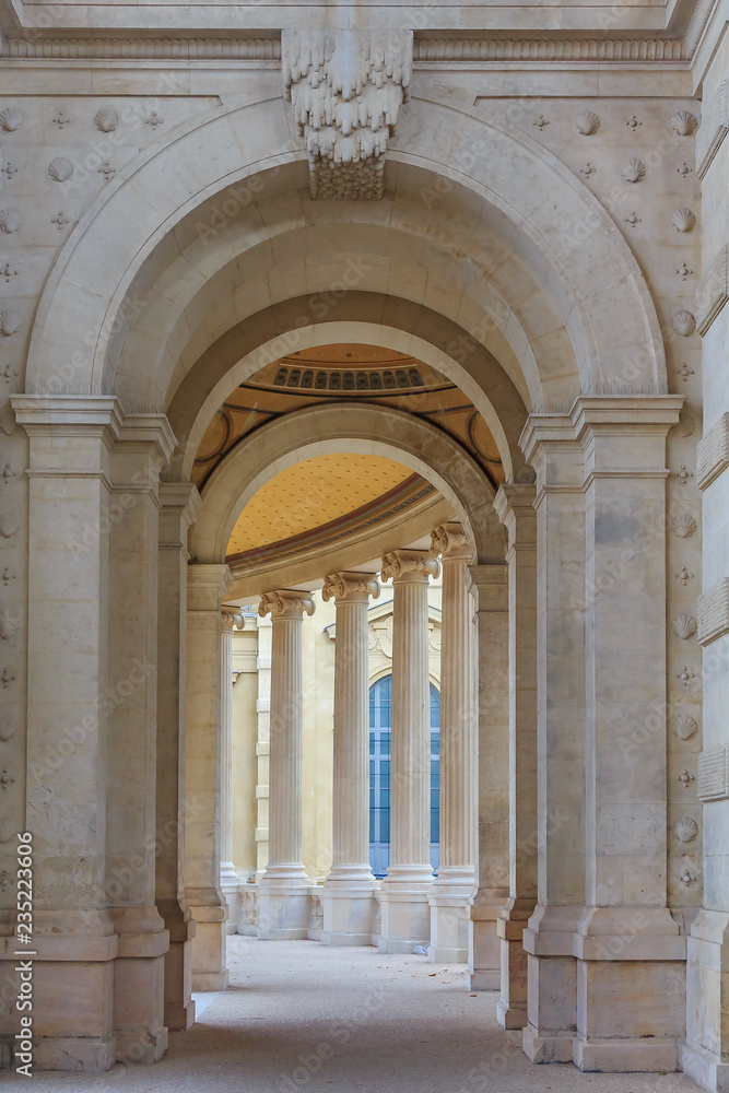 Ornate archway with a perspective view onto the Roman style colonnade at the Palais Longchamp in Marseille, France