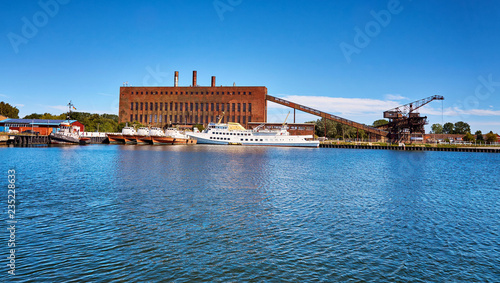 Port of Peenemünde with patrol boats and a large military boat.