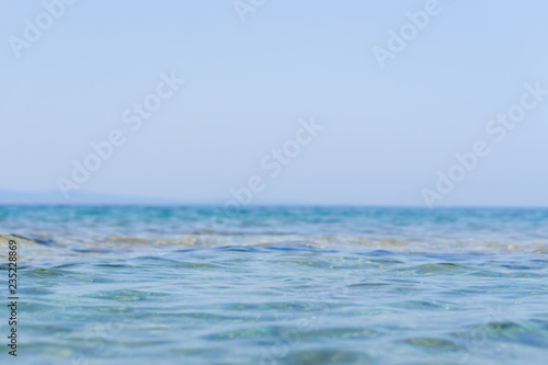Sea water on sunny day, nature background. Ocean view on sunny summer day