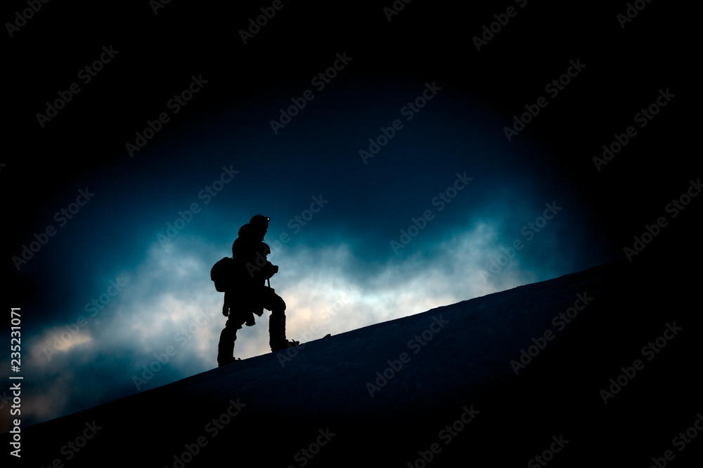 Hiker silhouette in low key scenario