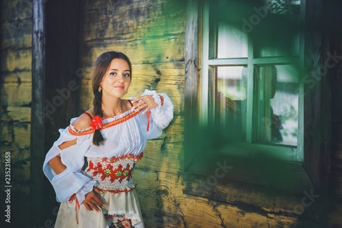 Beautiful young Russian girl in national costume