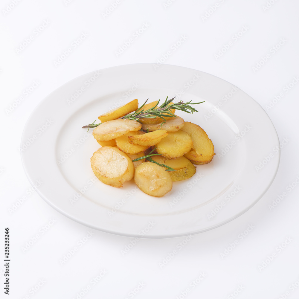 Crunchy fried potato slices with fresh rosemary isolated on white background