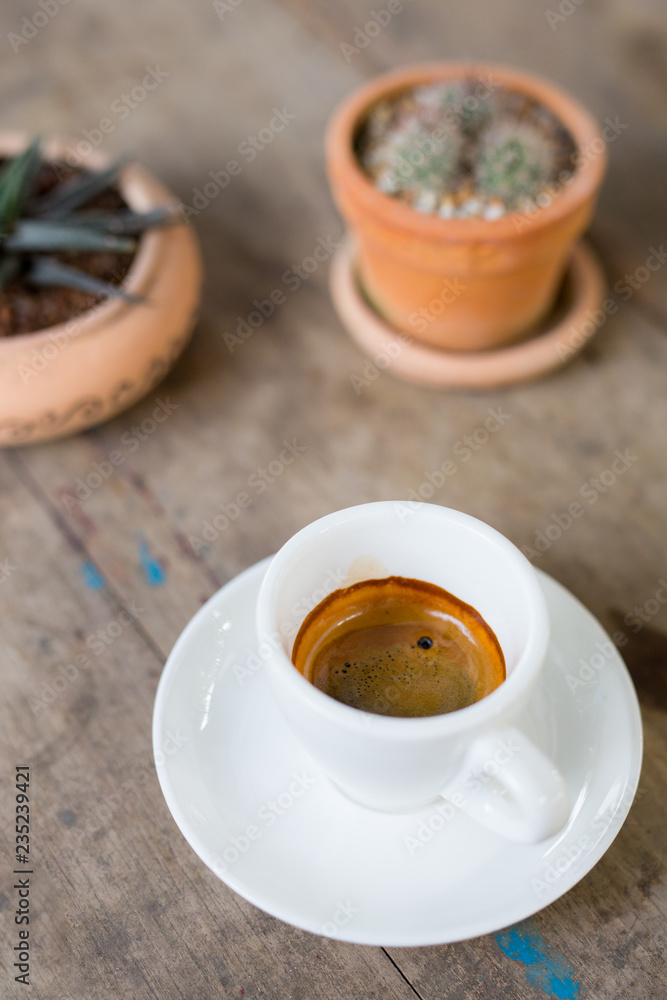 hot coffee in mug on wood table