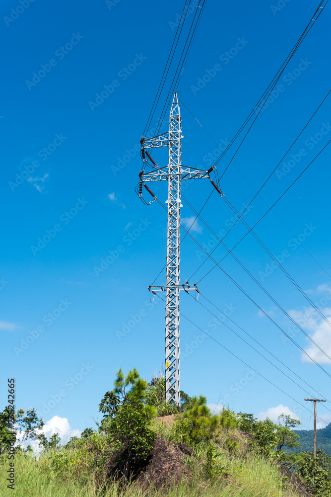 Obraz premium Electrician stays on the tower pole