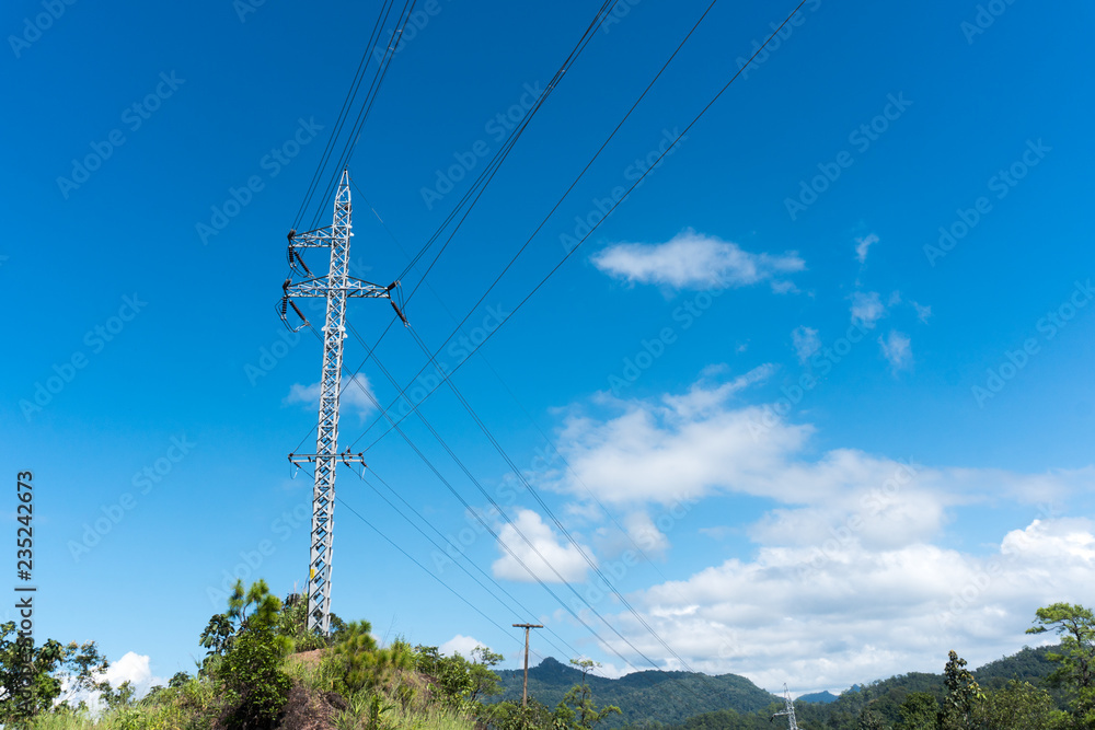 Obraz premium Electrician stays on the tower pole