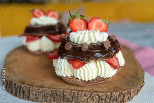 Chocolate pavlova with fresh strawberries and whipped cream