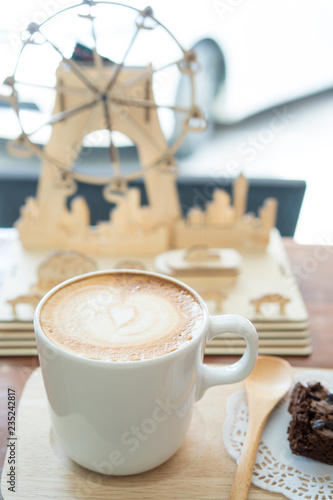 Fototapeta Naklejka Na Ścianę i Meble -  Hot latte art coffee and Chocolate brownie on wood table