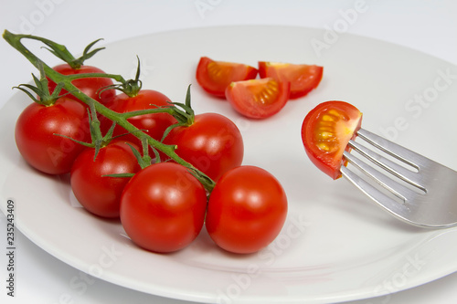 fresh tomatoes on a plate © Goldcoinz
