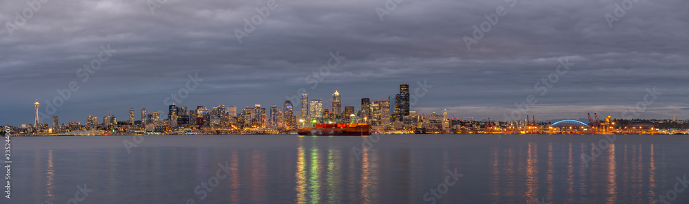 Fototapeta premium Seattle Lighted Skyline Reflected on the Ocean