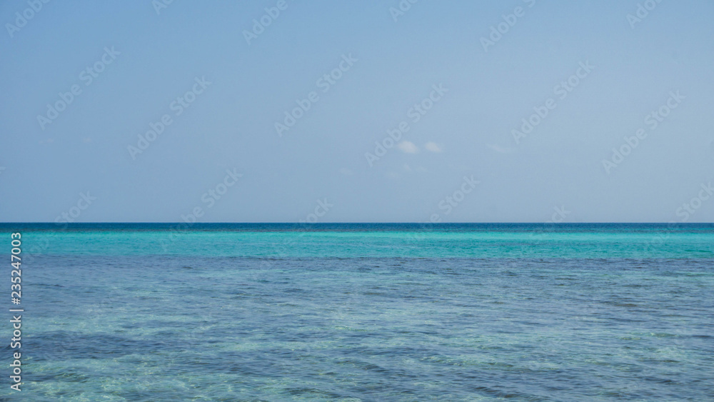 transparent and clear blue green sea with clear sky in karimun jawa