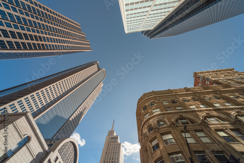 Canvas Print Upward view of skyscrapers against blue sky in the business district area of downtown Dallas, Texas, USA