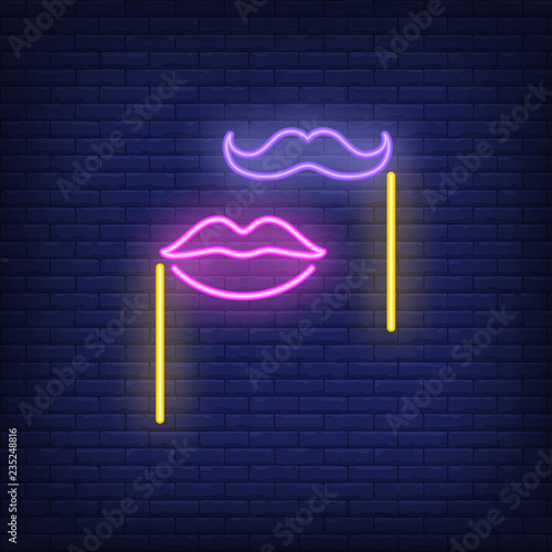 Fake moustache and lips on sticks neon sign. Party or advertisement design. Night bright neon sign, colorful billboard, light banner. Vector illustration in neon style.