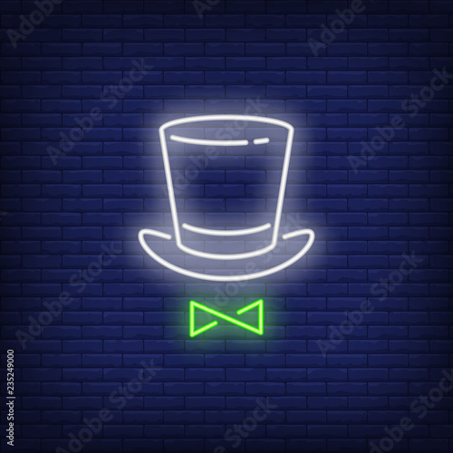 Top hat and bow tie neon sign. Performance or advertisement design. Night bright neon sign, colorful billboard, light banner. Vector illustration in neon style.