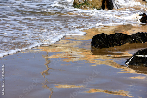Water and waves on the beach at Coffs Harbour NSW © michael