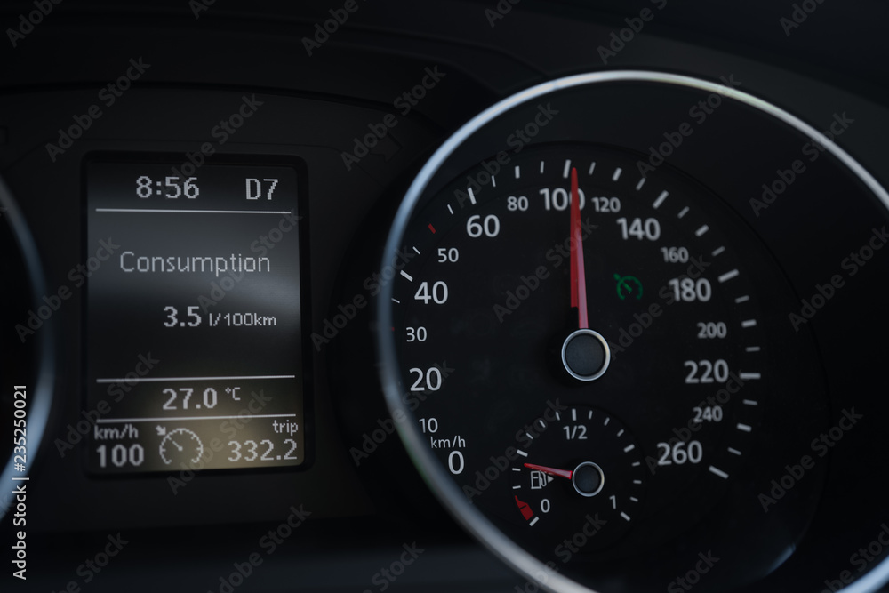 A Modern Car odometer Cluster with LCD Multifunction Display. Meter at constant speed show the fuel consumption efficiency A Modern Car odometer Cluster with LCD Multifunction Display. Meter at constant speed show the fuel consumption efficiency