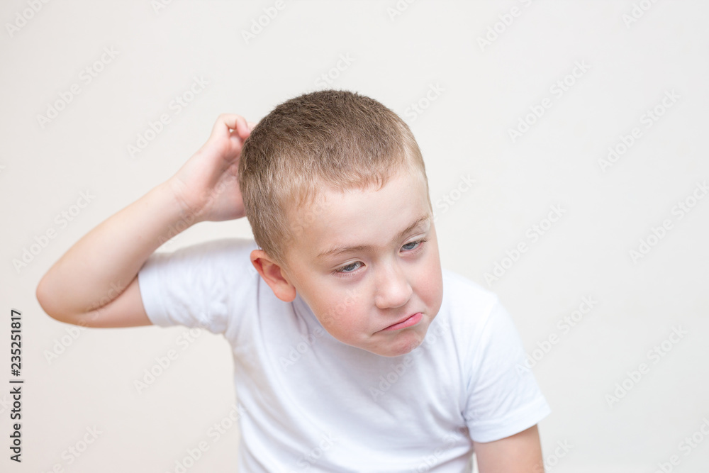 five year old boy with a funny facial expression five year old boy with a funny facial expression