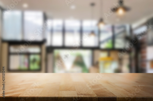 Fototapeta Naklejka Na Ścianę i Meble -  Wooden board empty Table Top And Blur Interior over blur in coffee shop Background, Mock up for display of product