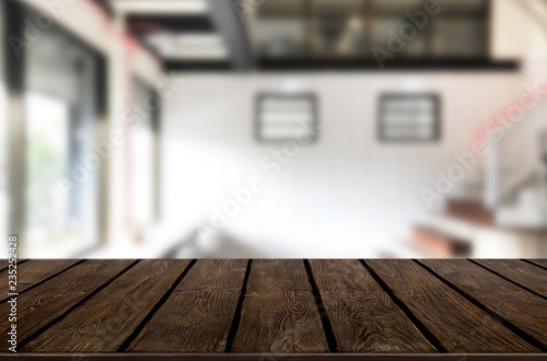 Wooden board empty Table Top And Blur Interior over blur in coffee shop Background, Mock up for display of product © snowing12