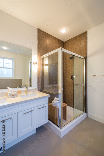 Luxury bright bathroom with a shower cabin. Interior design.