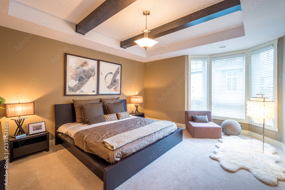 Fototapeta premium Modern bright bedroom interior with designer pillows in a luxury house, hotel.