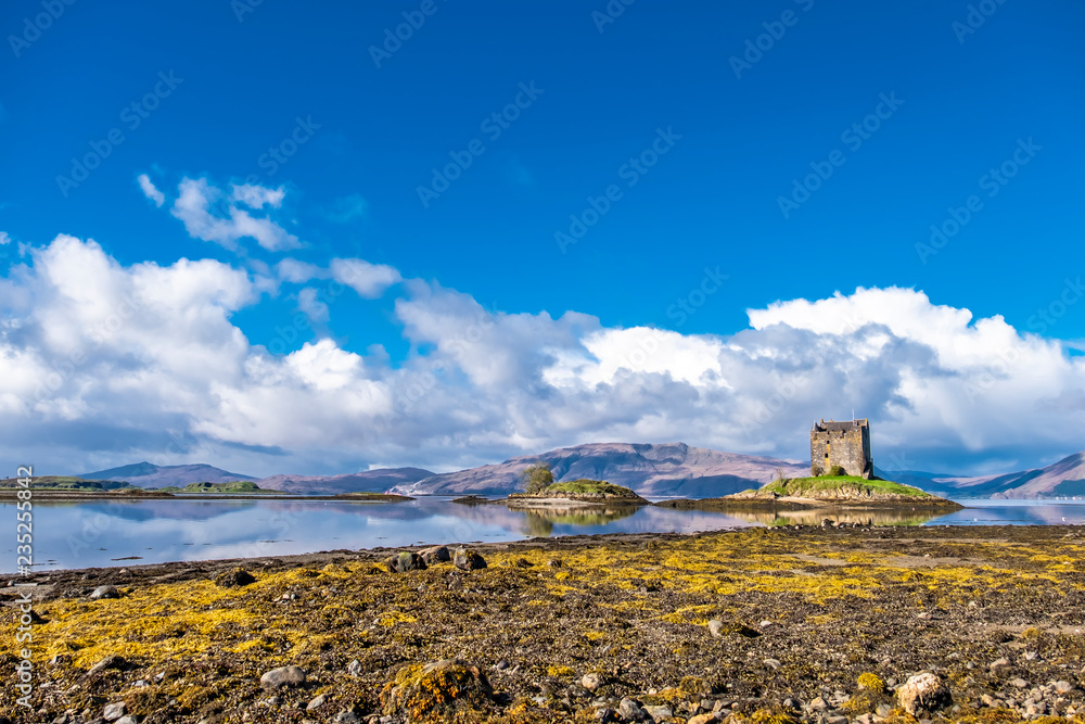 View of the Castle Stalker in autumn on the low tide near Port Appin, Argyll - Scotland