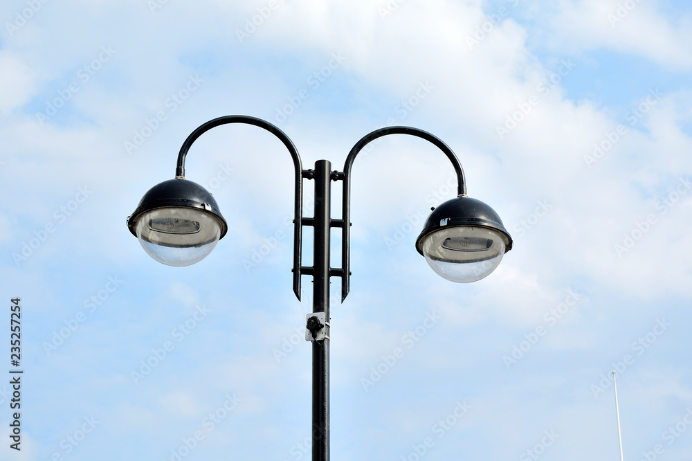 Close-up of street light against blue sky Close-up of street light against blue sky
