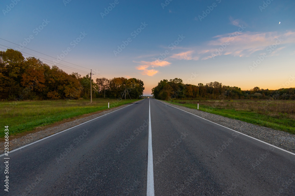 Scenic view of a new road through autumn trees