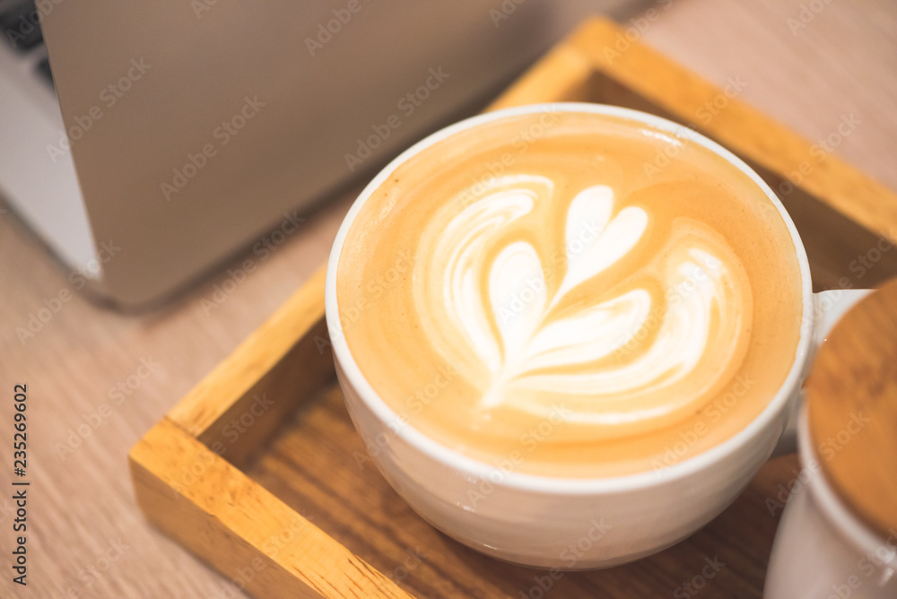 Close up latte coffee on the working table.. Close up latte coffee on the working table..