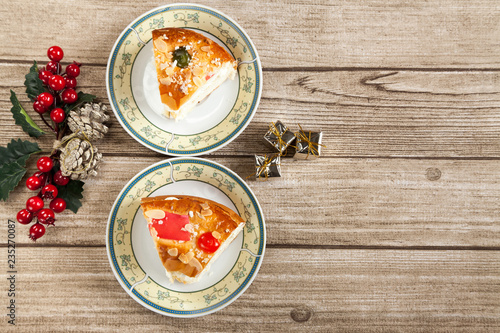 Wallpaper Mural Two cut pieces of Spanish typical dessert of epiphany and Christmas ornaments from above Torontodigital.ca