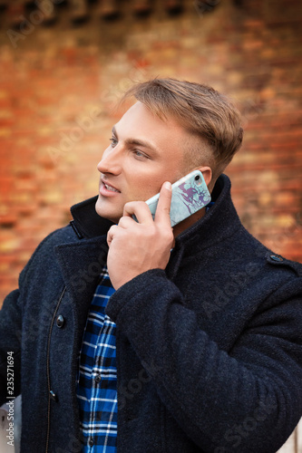 Young beautiful man with a mobile telephone