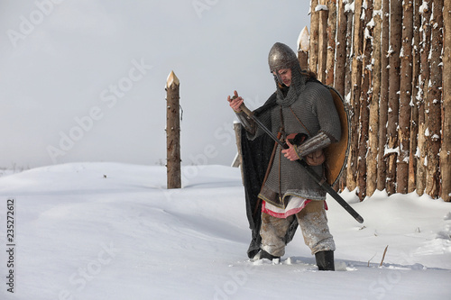 Defender the young warrior in mail armor photo