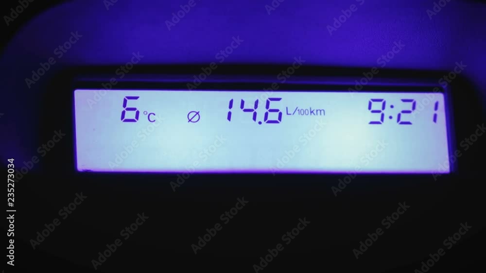 Close-up of the on-Board car computer with fuel consumption, temperature and time in the vehicle Close-up of the on-Board car computer with fuel consumption, temperature and time in the vehicle