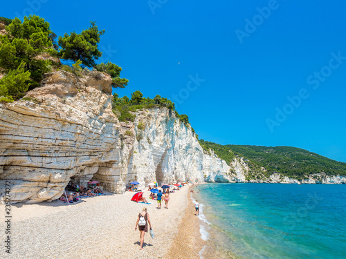 APULIA, IT - Jul 19, 2018: Mattinata Faraglioni stacks and beach coast of Baia Delle Zagare, Vieste Gargano, Apulia, Italy